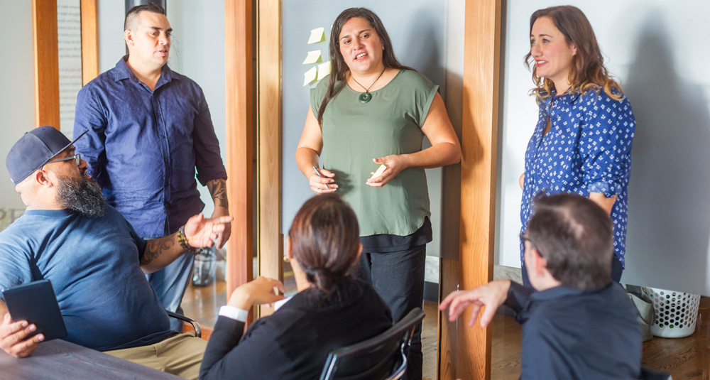 A couple of Boosters enjoying a discussion with a client who has joined us in the Boost studio to collaborate on their project.