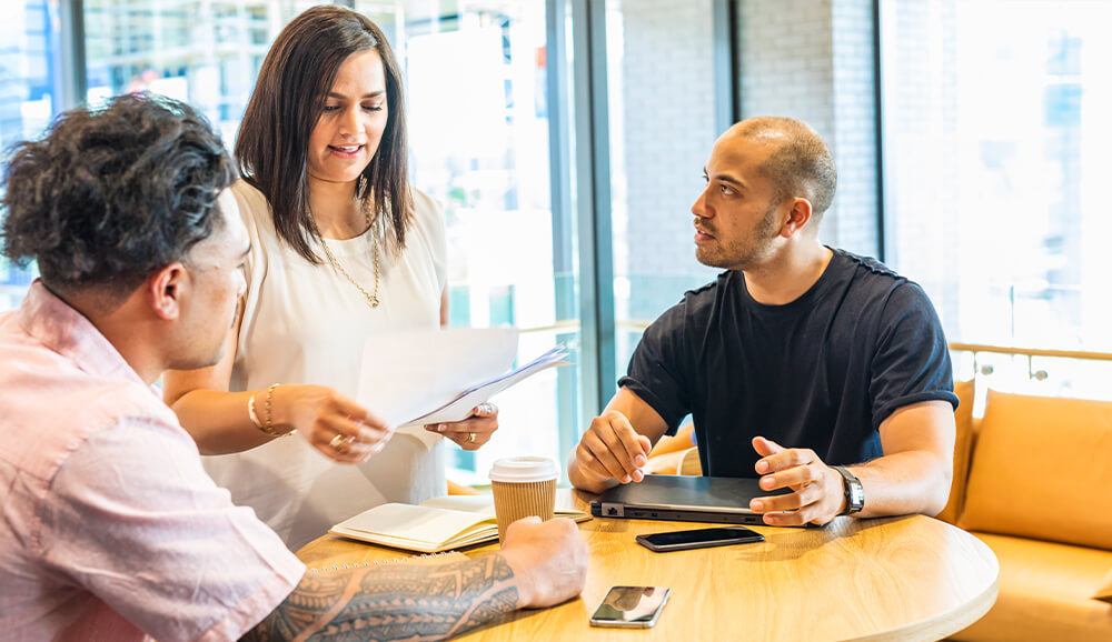 A couple of Boosters enjoying a discussion with a client who has joined us in the Boost studio to collaborate on their project.